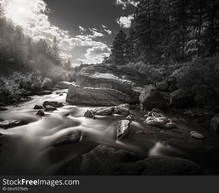 Black and white scene of a mountain river in the Rocky Mountains of Colorado. This is a long exposure so the river is smooth and silky looking. Black and white scene of a mountain river in the Rocky Mountains of Colorado. This is a long exposure so the river is smooth and silky looking.