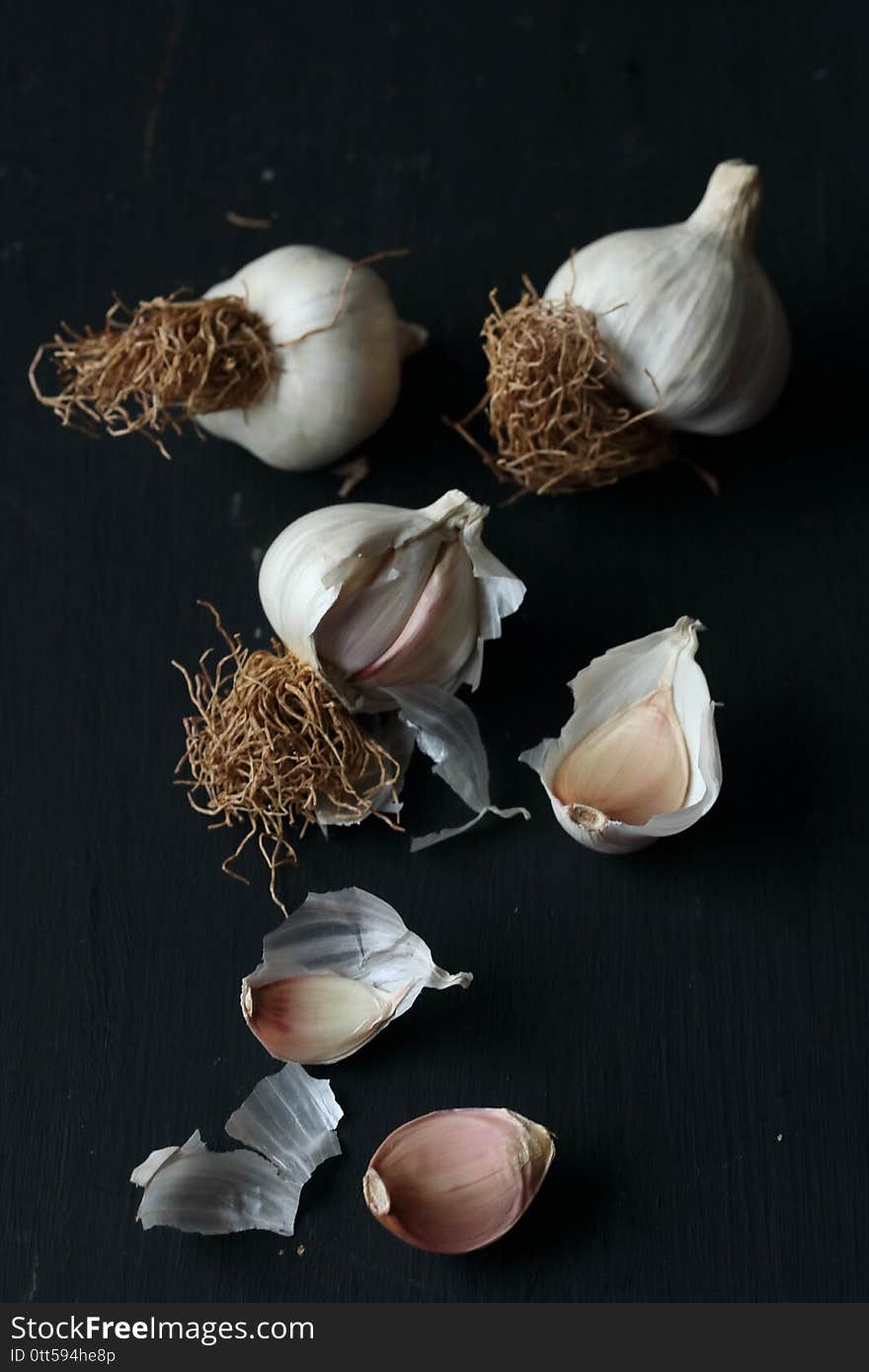 Garlic, organic natural garlic on a black background