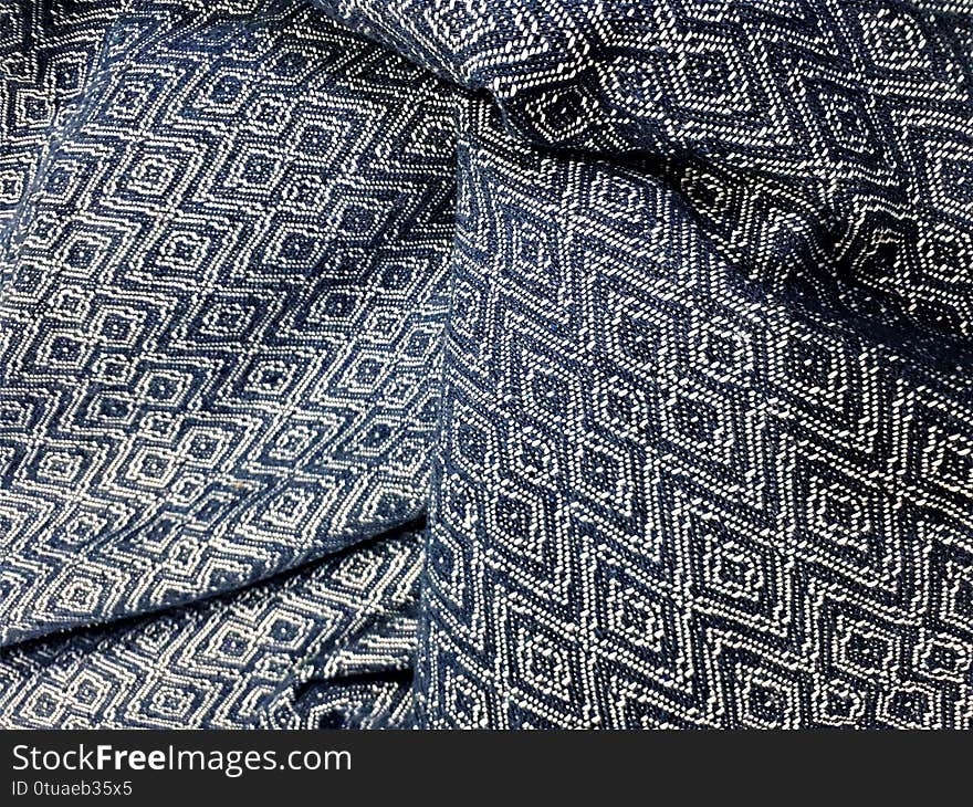 Close-up of dense fabric with abstract spots, patterns and blur. Design for outerwear, curtains, bedspreads, wallpaper.