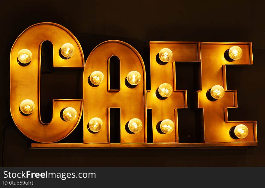 Umea, Norrland Sweden - December 10, 2019: cafe sign glowing with incandescent lights