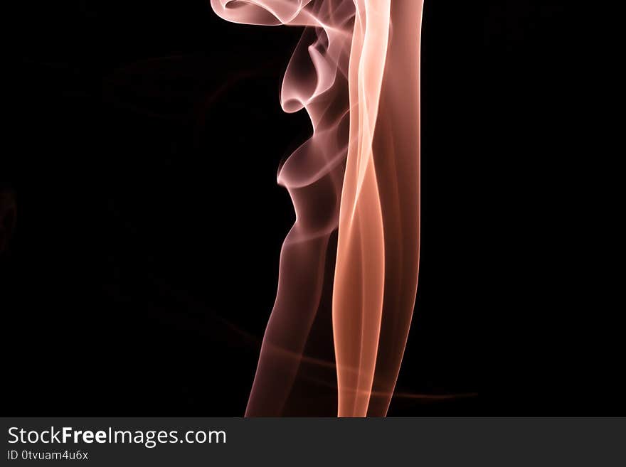 Colored smoke on a black background.