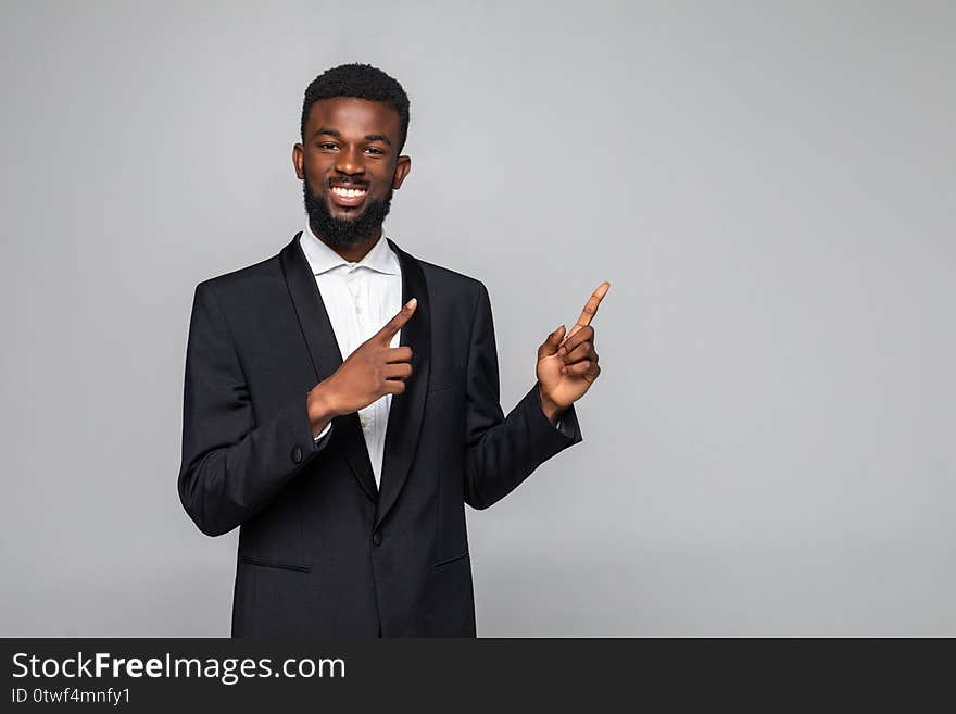 Businessman pointing at something on white background. Businessman pointing at something on white background