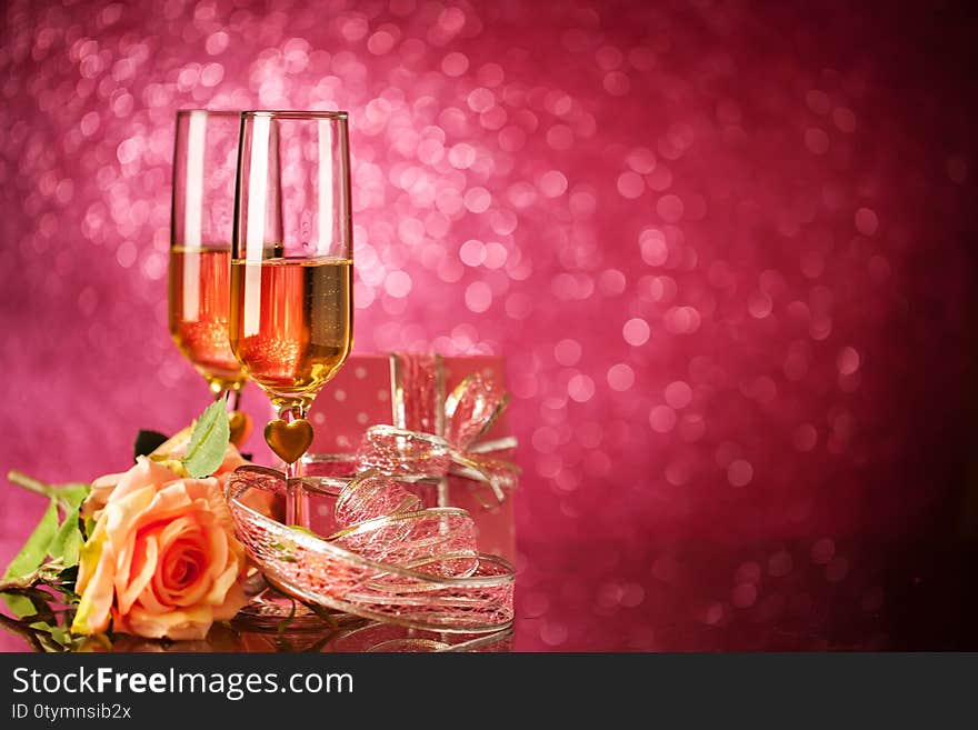 Champagne Glasses On A Beautiful Bokeh Background. Valentine`s Day. Background With Copy Space. Selective Focus