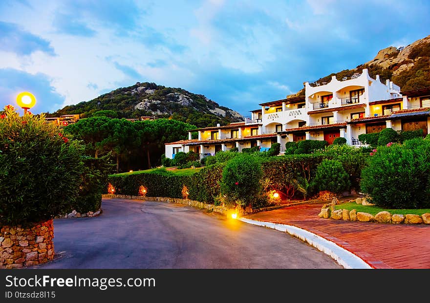 Landscape and scenery of Baja Sardinia luxury resort on Costa Smeralda at sunset in the evening, Sardegna island in Italy summer. Olbia province. Villa at Mediteranean sea. Landscape and scenery of Baja Sardinia luxury resort on Costa Smeralda at sunset in the evening, Sardegna island in Italy summer. Olbia province. Villa at Mediteranean sea