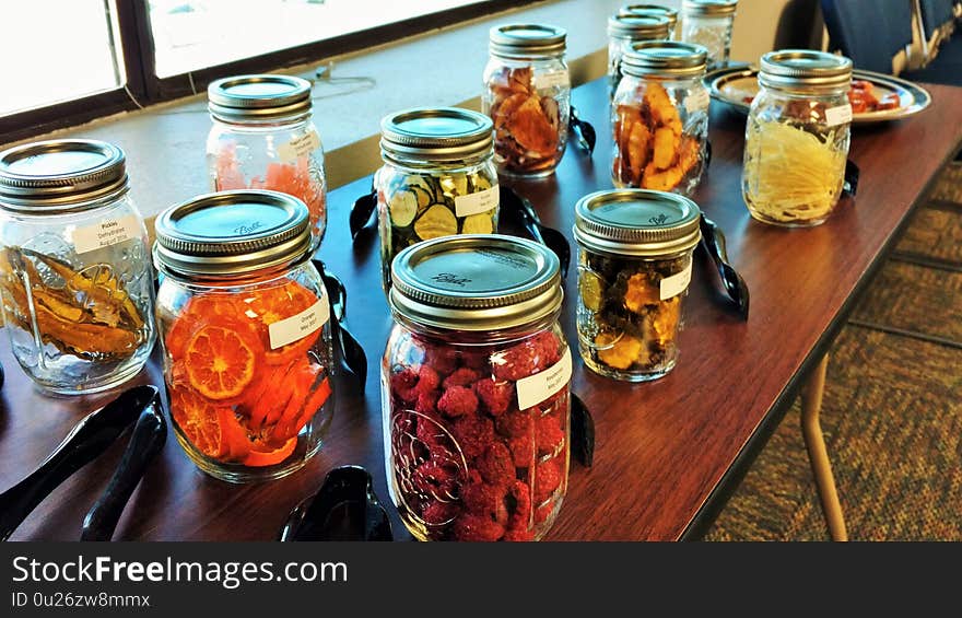 Dehydrated fruits and vegetables in labeled mason jars