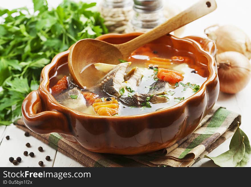 Fish soup with vegetables on the table. Fish soup with vegetables on the table
