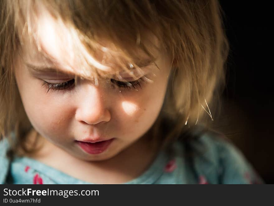 Portrait of very sweet little child with big eyes. 2 year old baby girl. Baby development concept. Copy space