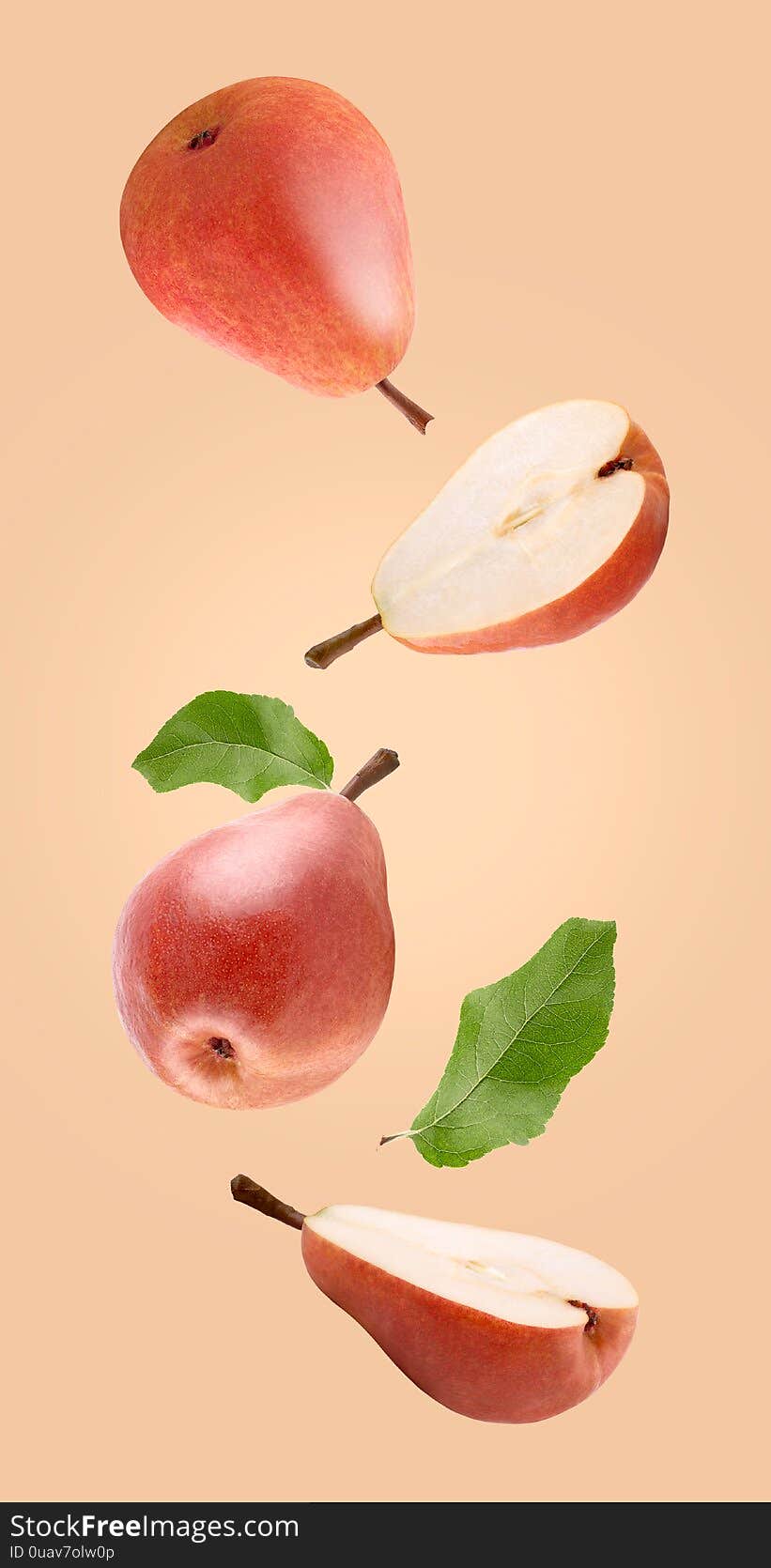 Floating pear fruits isolated on coloured background