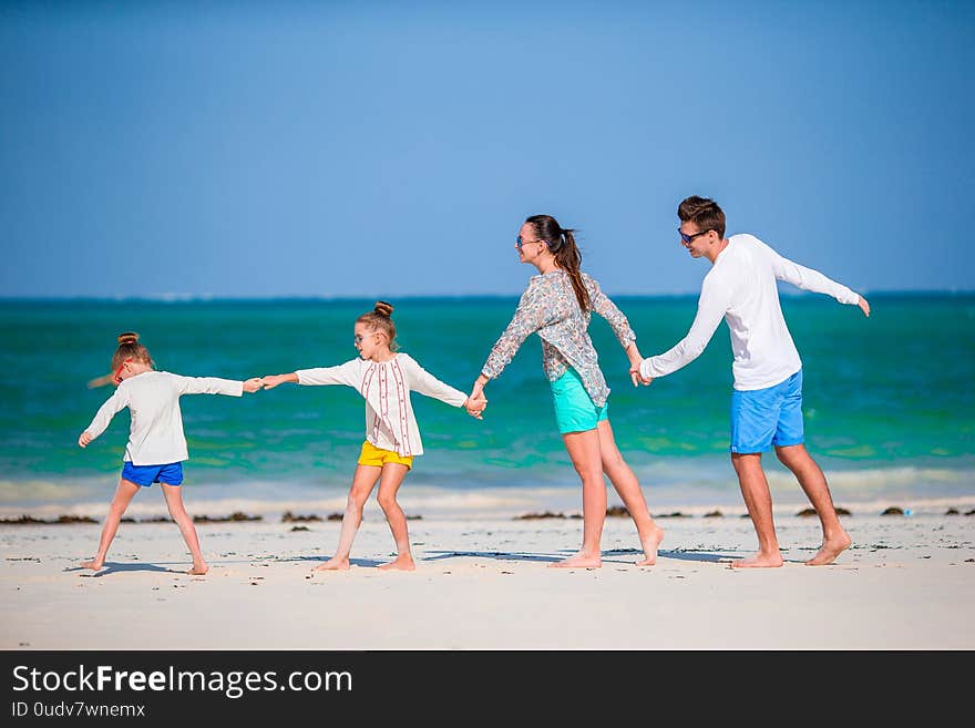 Family fun. Parents with kids on the beach. Family fun. Parents with kids on the beach