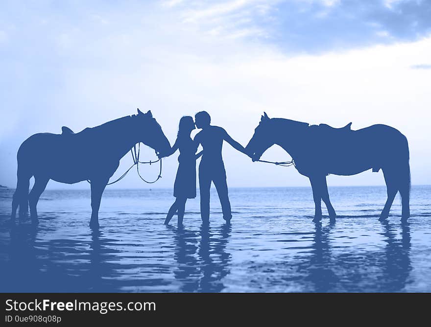 Couple in love at sunset in the sea.