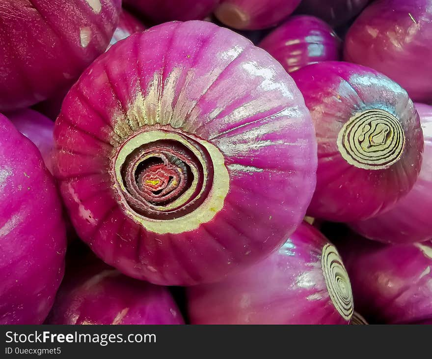 Organic red onions sold at local farmers market. Organic red onions sold at local farmers market.