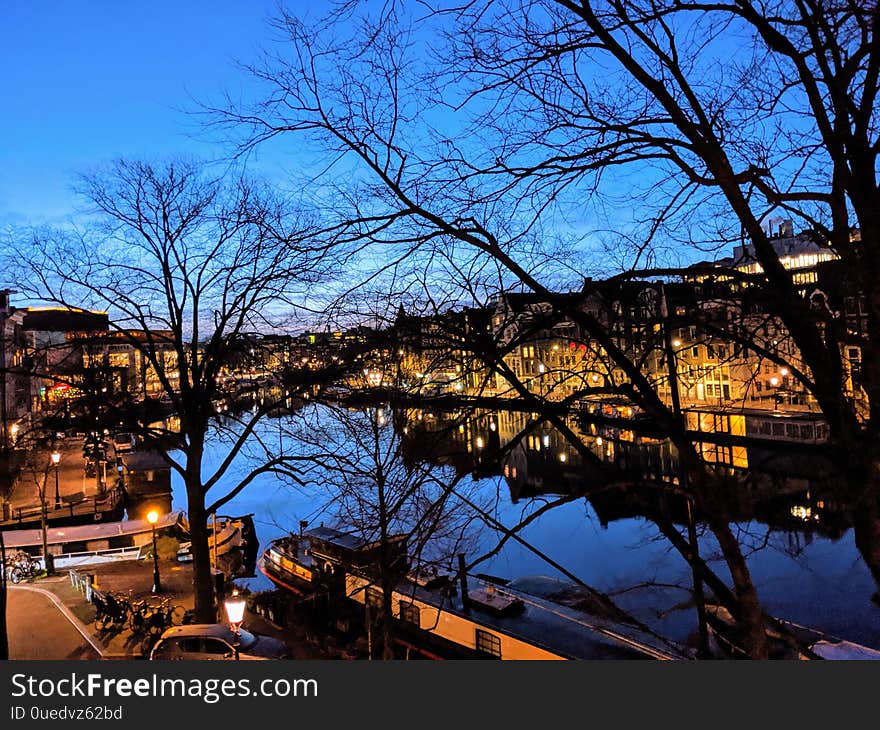 Canals and houses of Amsterdam city at sunrise, in Holland, Netherlands