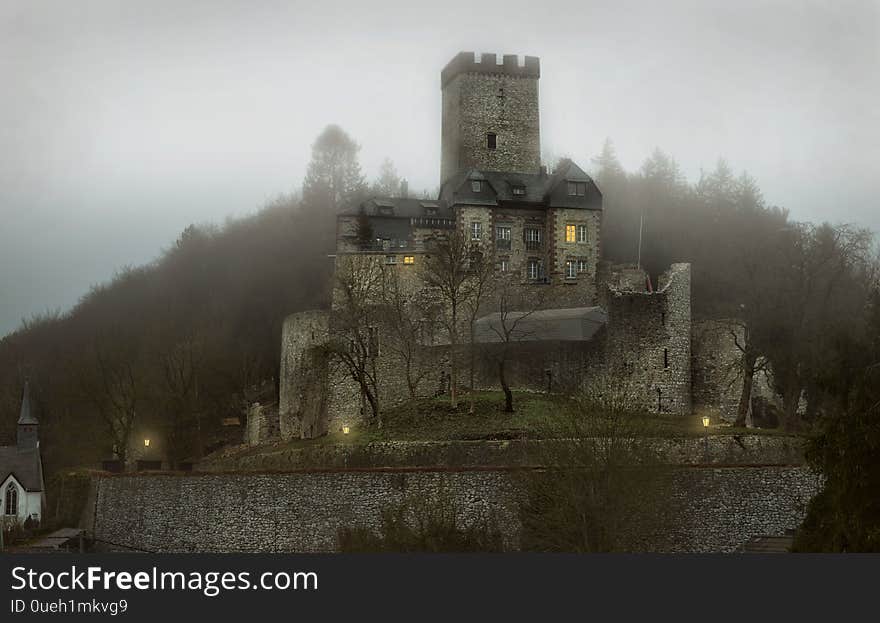 Kerpen Castle in the Eifel in Germany in the evening in the fog