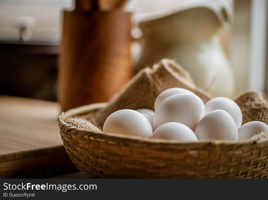 Chicken eggs in basket on table.
Fresh chicken eggs.