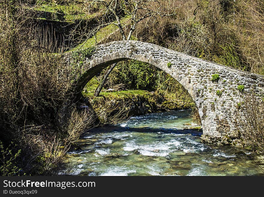 Medieval bridge on the stream of Equi Terme, ancient village in Tuscany, Italy