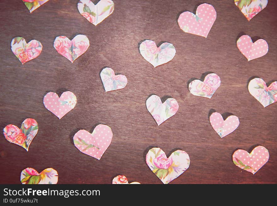 Soft pink paper hearts on a retro wood background. Valentine&#x27;s day, with love