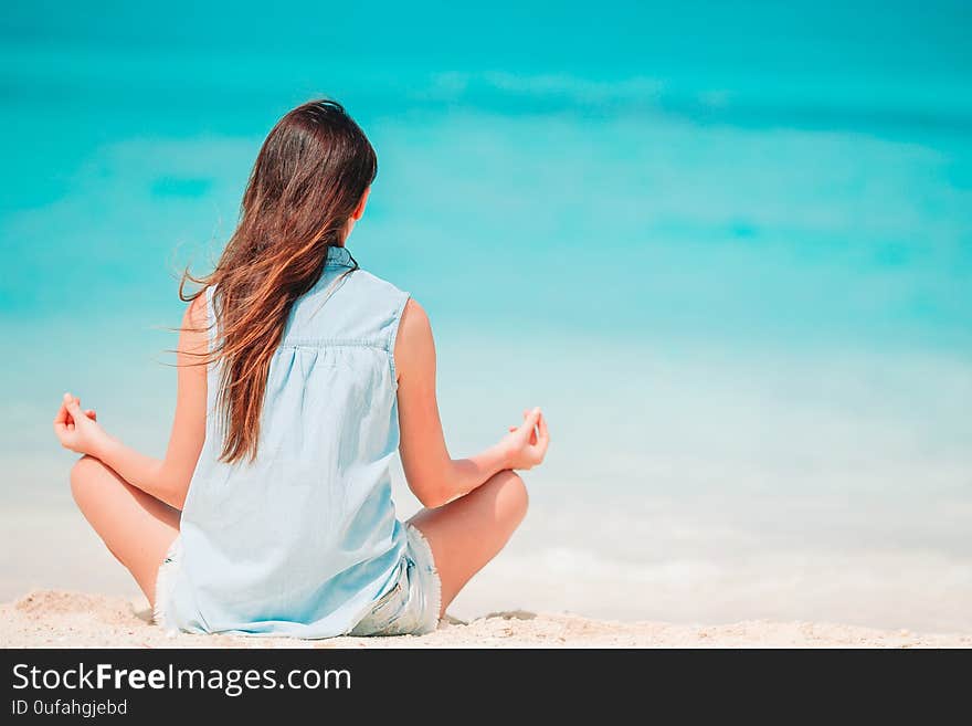 Young beautiful woman relaxing on the beach. Young beautiful woman relaxing on the beach