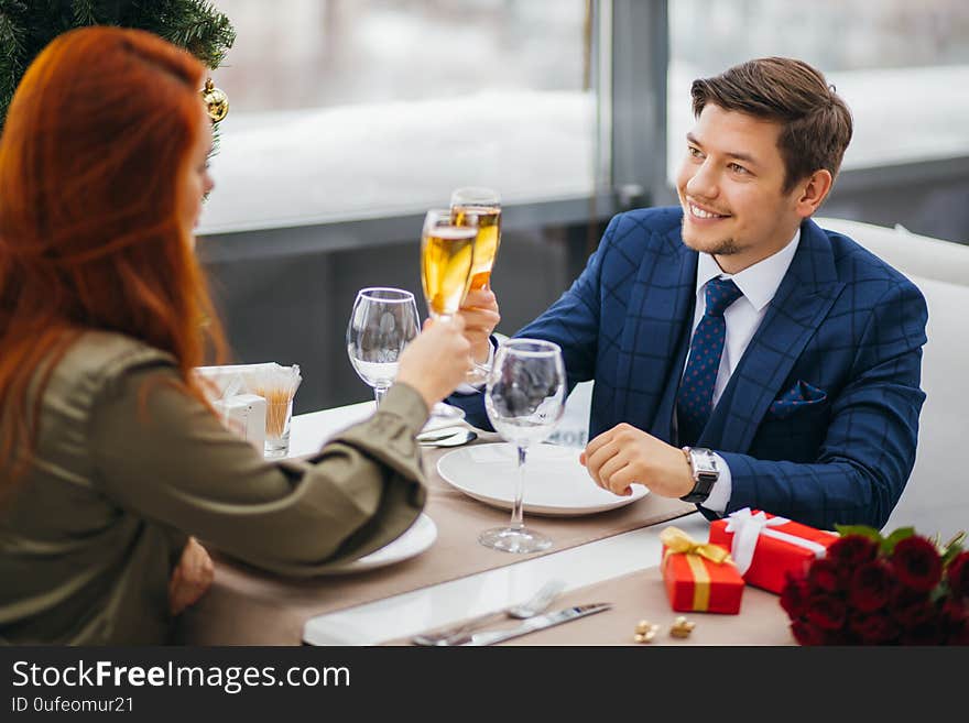 Young caucasian couple celebrating saint valentines day in restaurant