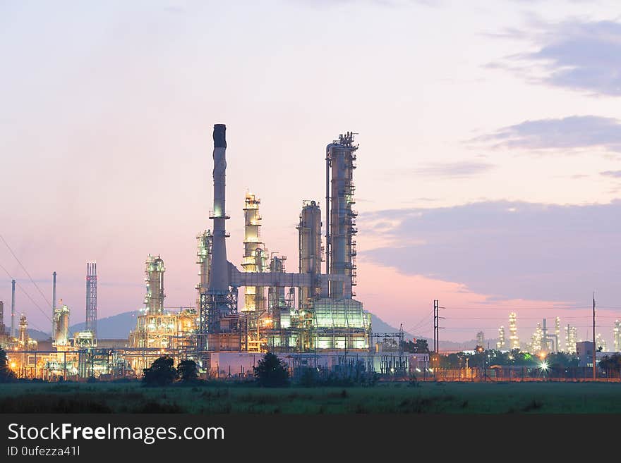 Oil refinery factory at processing work at twilight