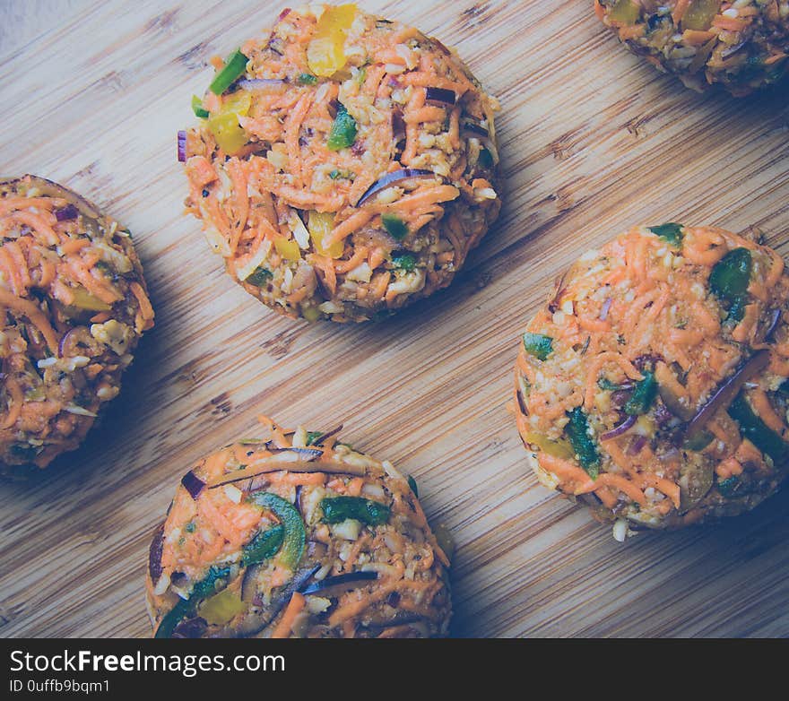 Fritters with carrots, sweet potato and feta cheese, served with yogurt and lime