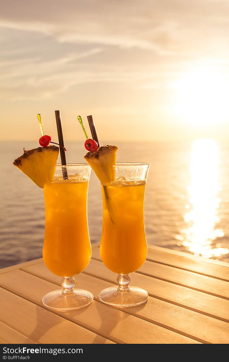 Fresh cool juicy orange pineapple coktails. Perfect wellness drink for enjoyment and relaxation at holiday cruise or vacation travel. Fresh cool juicy orange pineapple coktails. Perfect wellness drink for enjoyment and relaxation at holiday cruise or vacation travel