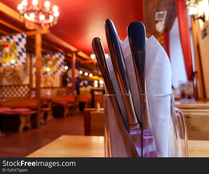 Cutlery In A Mug On A Table In A Restaurant