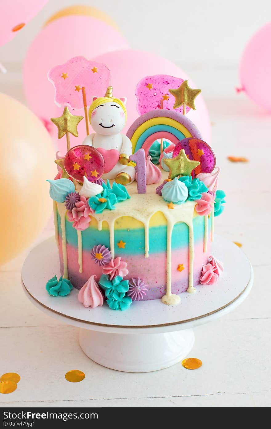 Party cake with unicorn for first birthday party