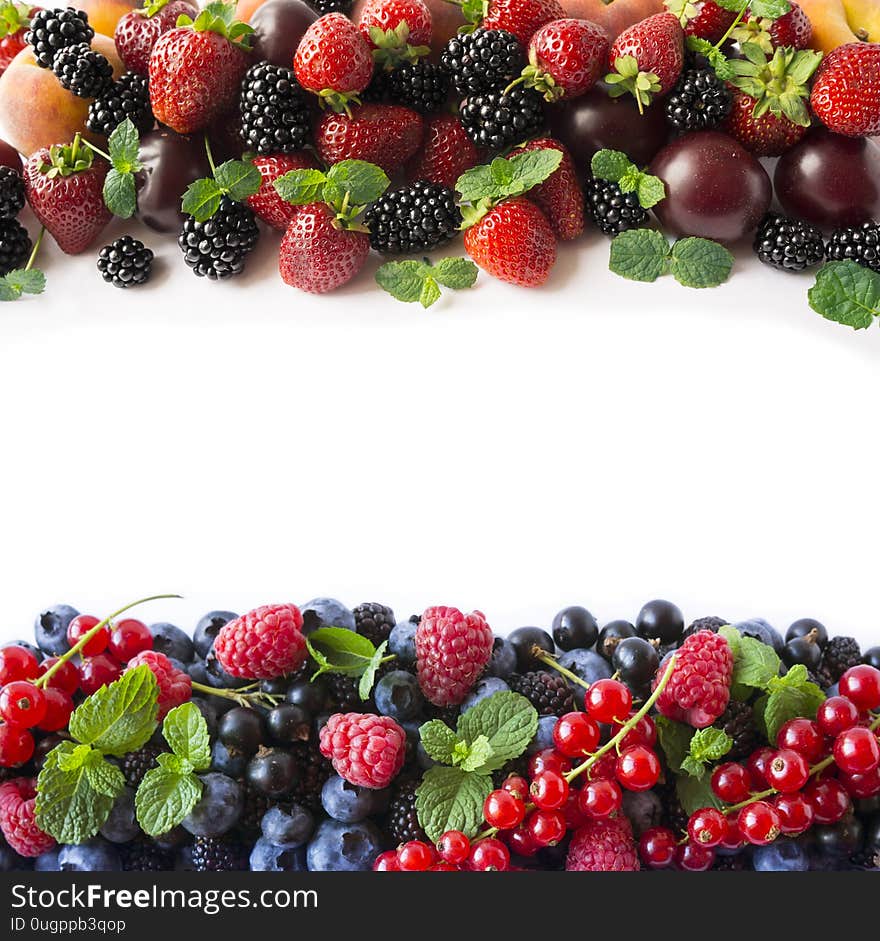 Mix berries on a white background. Ripe blueberries, blackberries, strawberries, currants and raspberries on white background. Top view. Fruits with copy space for text. Mix berries and fruits. Background berries and fruits. Various fresh summer fruits