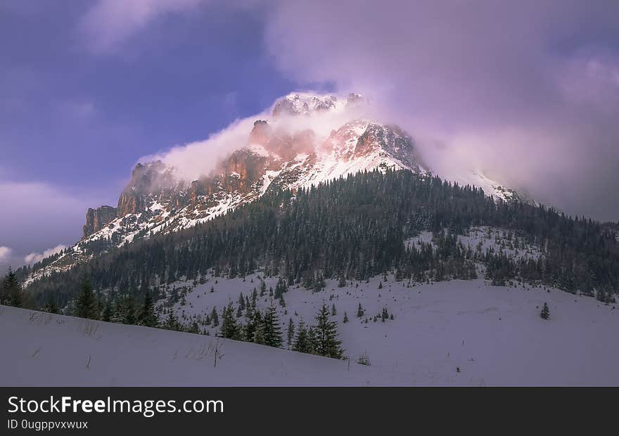 Mountain covered in clouds of cold weather wind blow upon. Mountain covered in clouds of cold weather wind blow upon