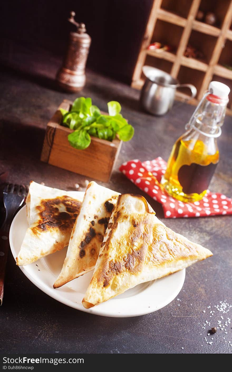 Fried flatbread stuffed with cheese and ham