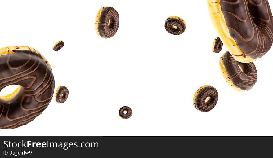 Cookie background. Glazed sweet doughnut falling on white. Sweet icing sugar food.