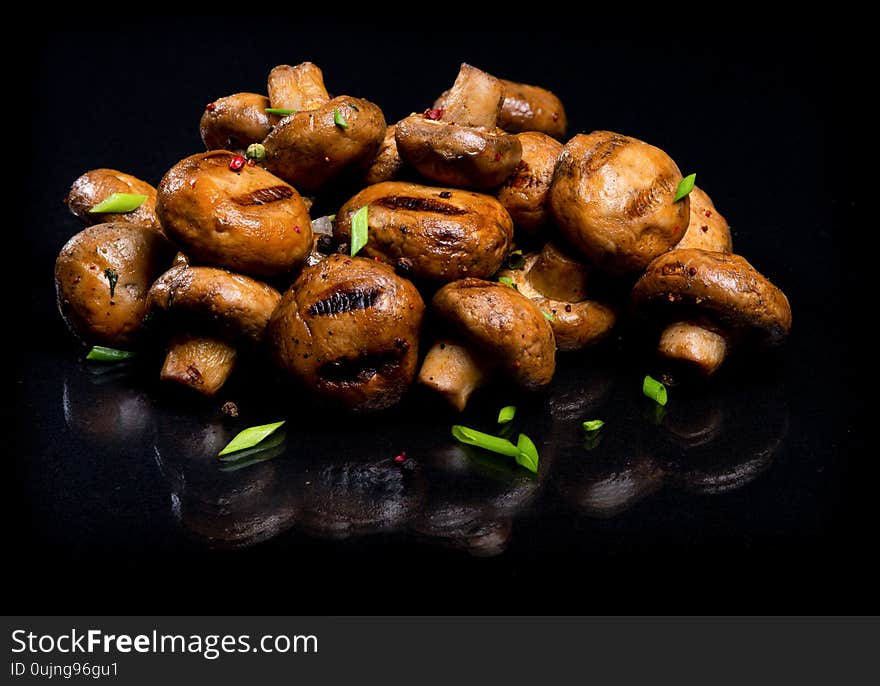 Champignon mushrooms cooked at the stake