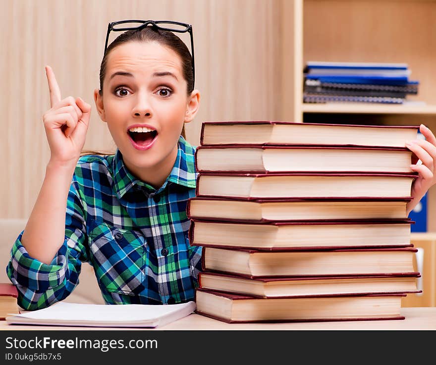 The young female student preparing for exams