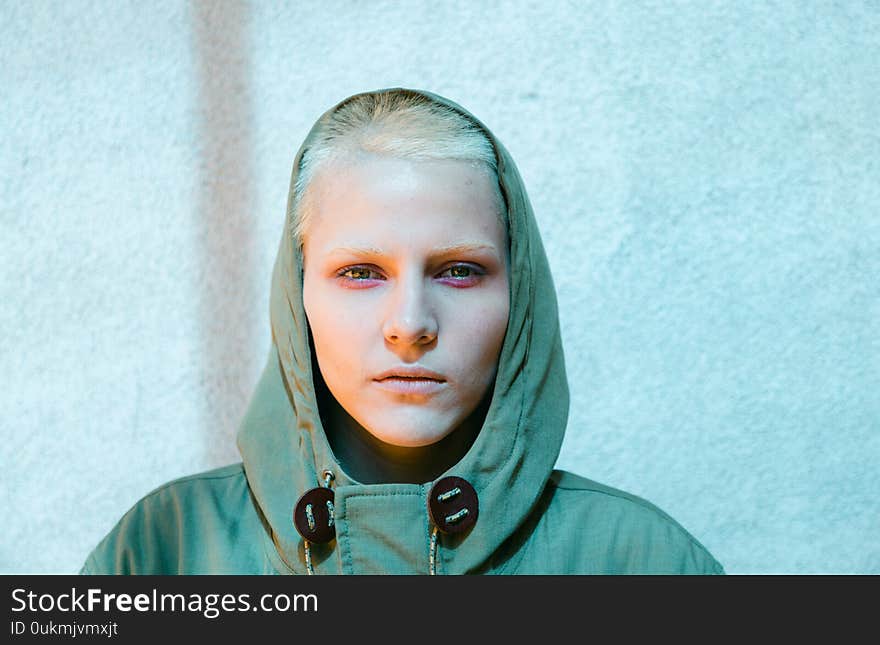 Young Androgyne Woman with short blond hair on the street