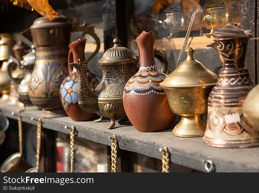 Bronze and copper handcrafted cookware in street shop. Shaki, Azerbaijan.