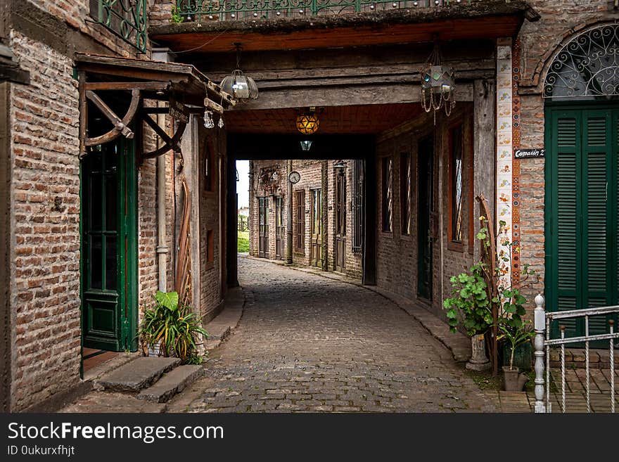 GONZALEZ CATAN, ARGENTINA, SEPTEMBER 28, 2019: cobblestone corridor through abandoned buildings in the amazing medieval town of