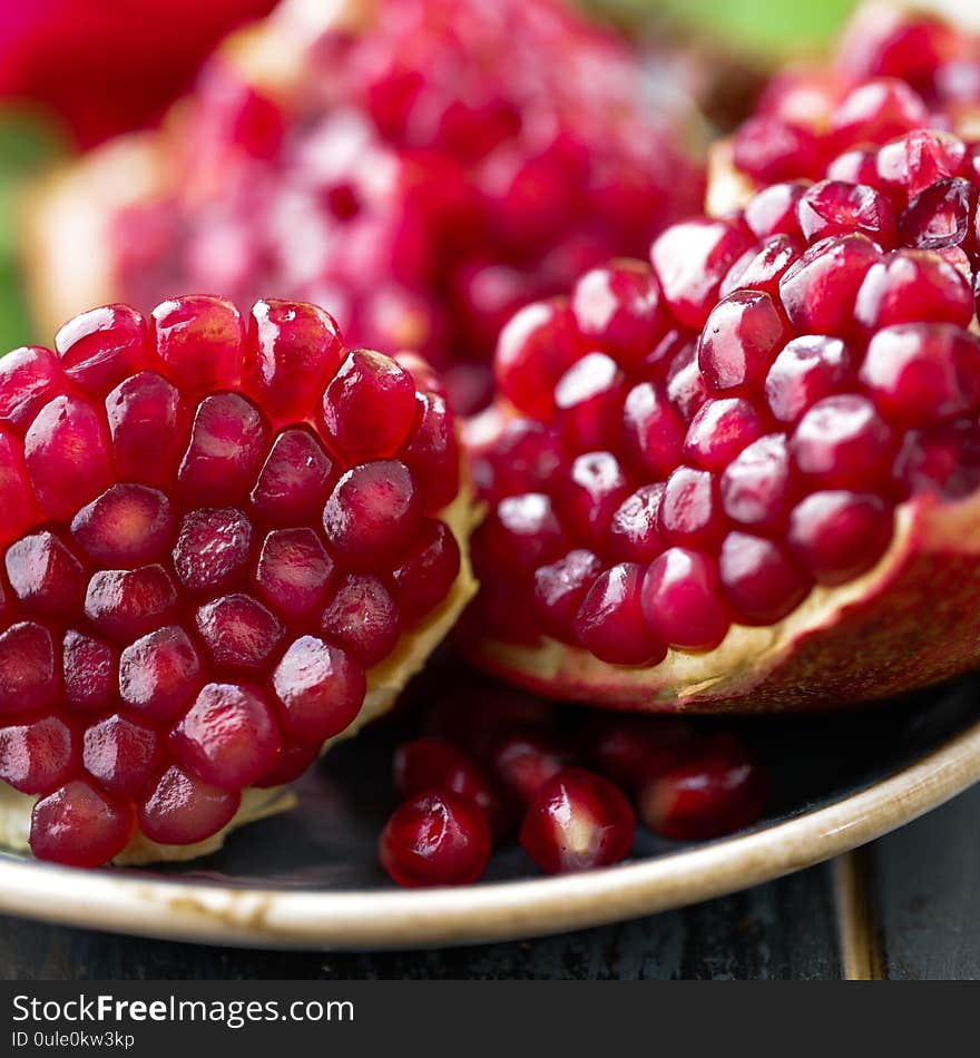 Pomegranate fruit, red pomegranate, close-up, macro close-up view of the red pomegranate grain. Juicy ripe red pomegranates or