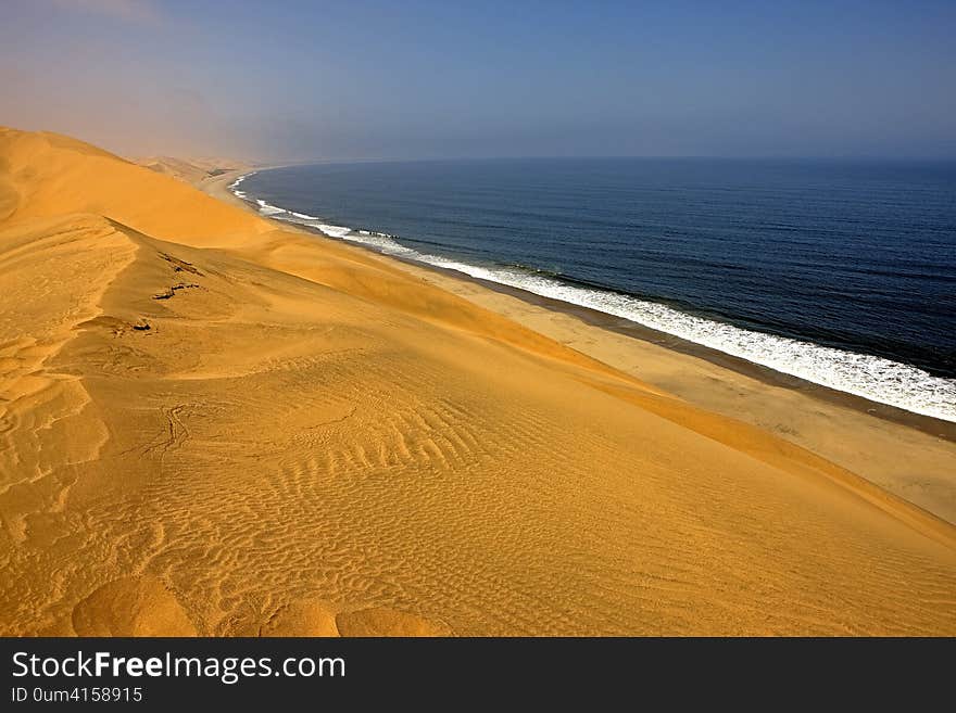 Sand Dunes and Ocean near Walvis Bay, Namibia. Sand Dunes and Ocean near Walvis Bay, Namibia