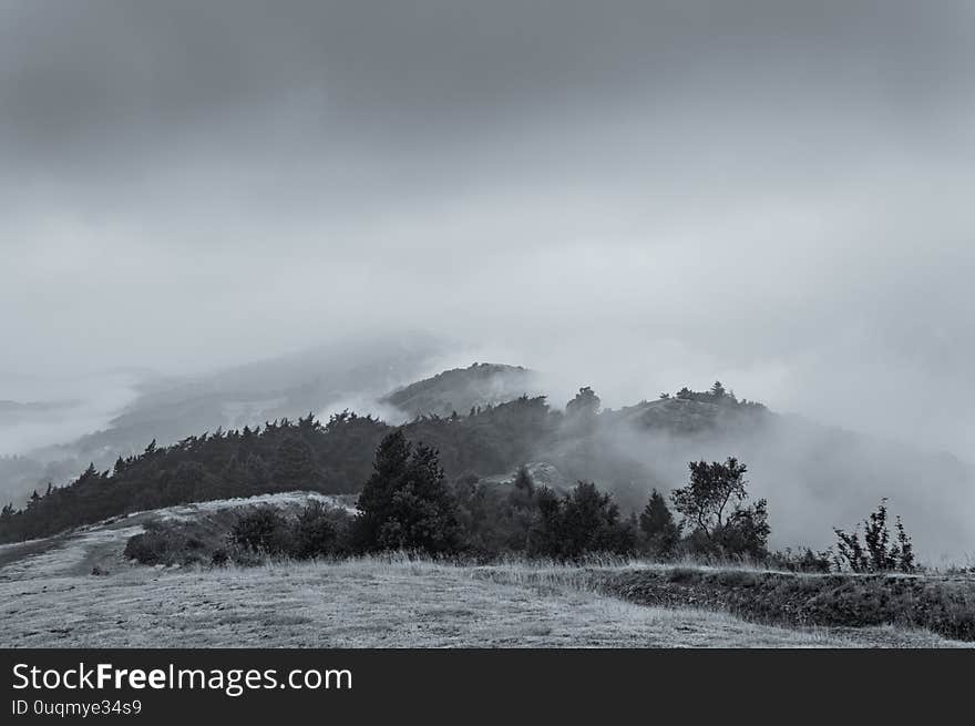 A warm summer early morning as the clouds start to lift above the Malvern Hills. Worcestershire, UK.