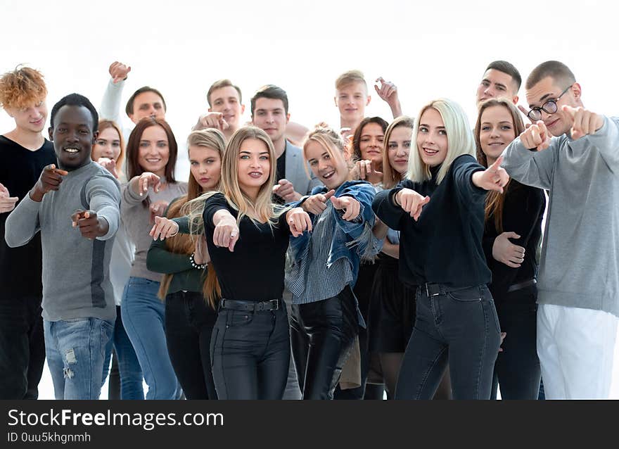 Group of confident young people pointing at you