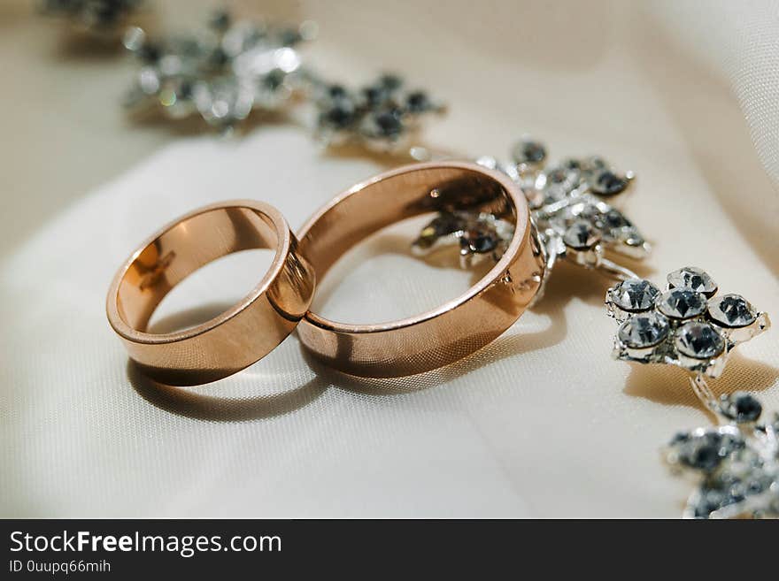 Two golden wedding rings on the cloth