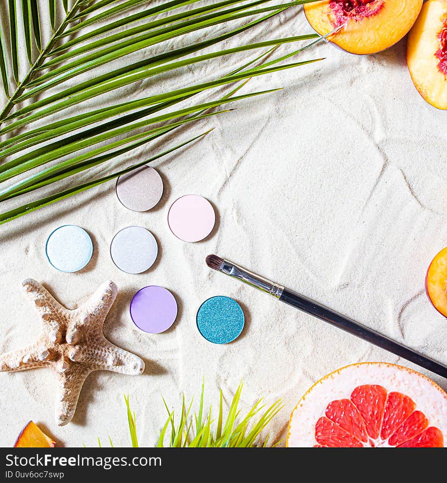 Charming beach. Round single shadows of different shades with fruits, starfish, and palm leaves lie on white sand.