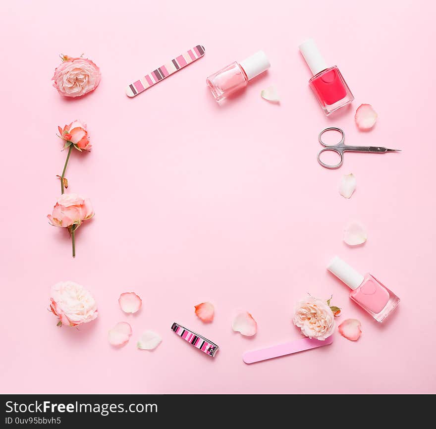 Different tools for manicure on pink background, top view. Frame shaped from tools for manicure