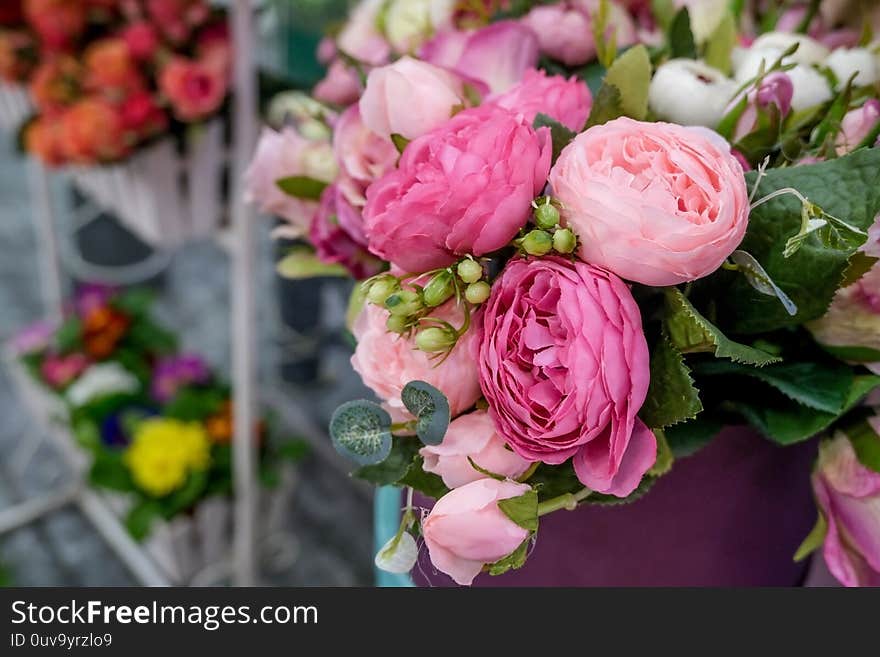 Artificial bouquet of flowers. Bouquet of mixed flowers. Floral shop, flower market. Concept of greeting, presents