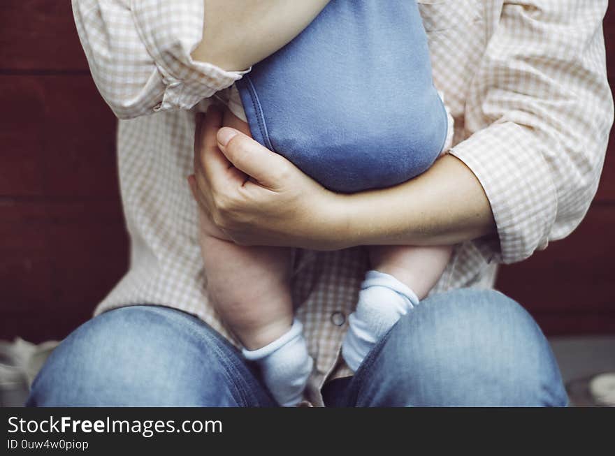 Baby On Grandmother Hands. Elderly Woman With Little Grandson