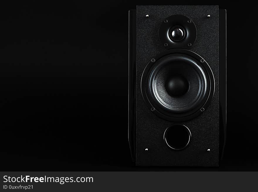 Audio speaker system on a black background. Minimalistic concept, free space