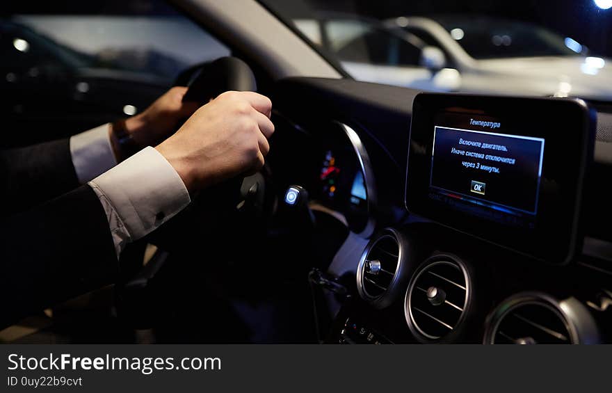 Close Up Hands On Steering Wheel. Shallow Dof