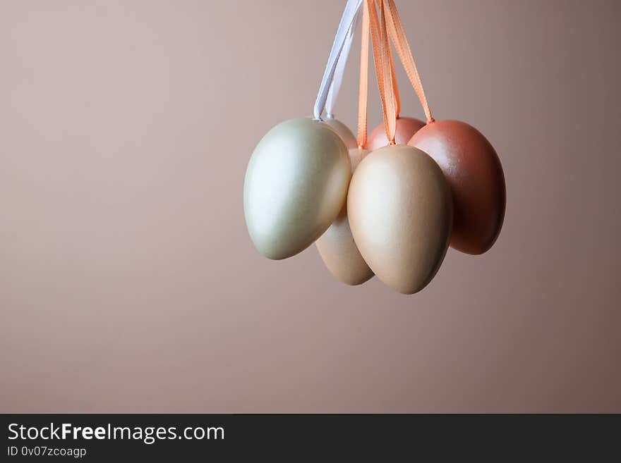 Decorated pearl easter eggs on a pink background. Minimal holiday concept. Happy easter background. Creative painting of eggs at home, the idea of simple drawings for coloring, a place for text. Decorated pearl easter eggs on a pink background. Minimal holiday concept. Happy easter background. Creative painting of eggs at home, the idea of simple drawings for coloring, a place for text