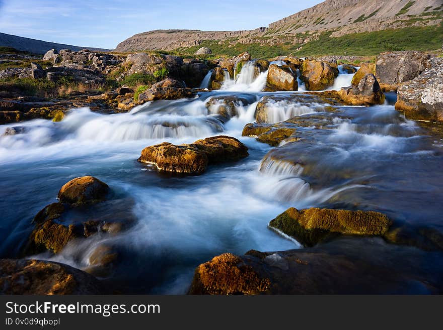 Iceland waterfall closeup view of the gods cliff with long exposure smooth motion of water in summer landscape.