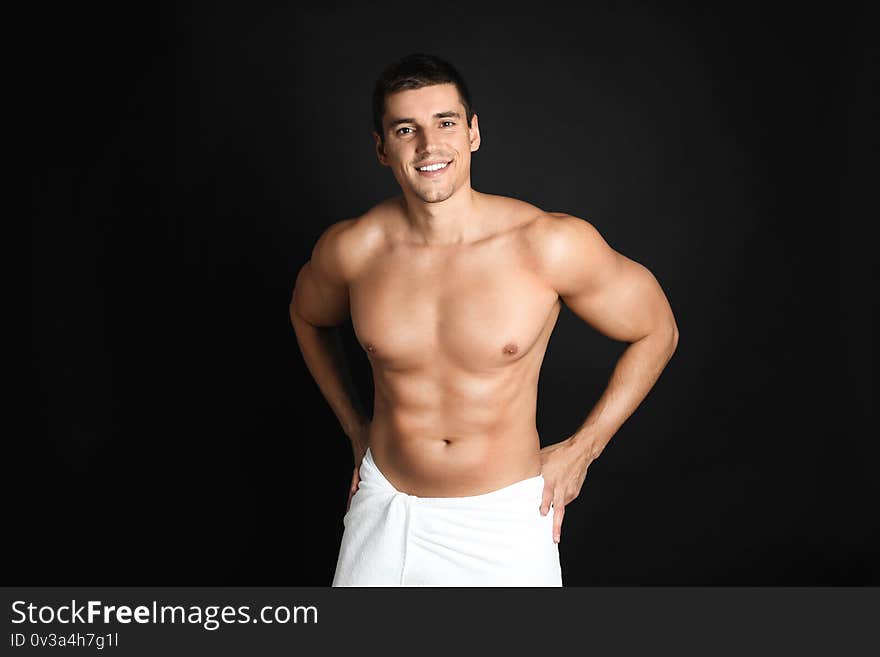 Man with sexy body on black background